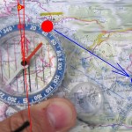 Compass usage on map (photo by Audrius Meskauskas, CC-BY-SA)