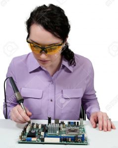 stock photo of woman soldering holding iron wrong